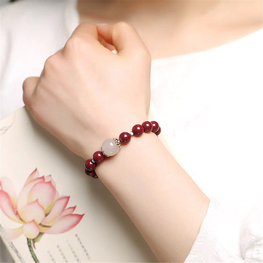 TRANSFORMERENDE KRACHT JADE & CINNABER KRALEN ARMBAND