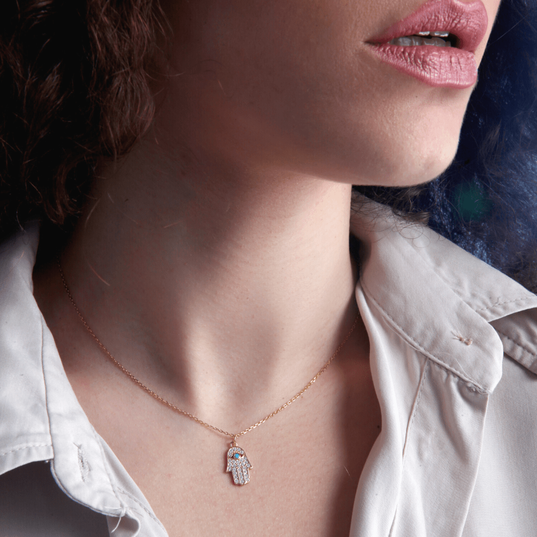 OVERVLOEDIGE VOORSPOED TURQUOISE & GOUDEN HAMSA HANDKETTING