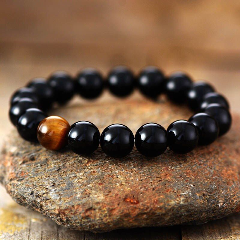 MOEDIGE KRACHT ZWARTE ONYX TIJGEROOG ARMBAND
