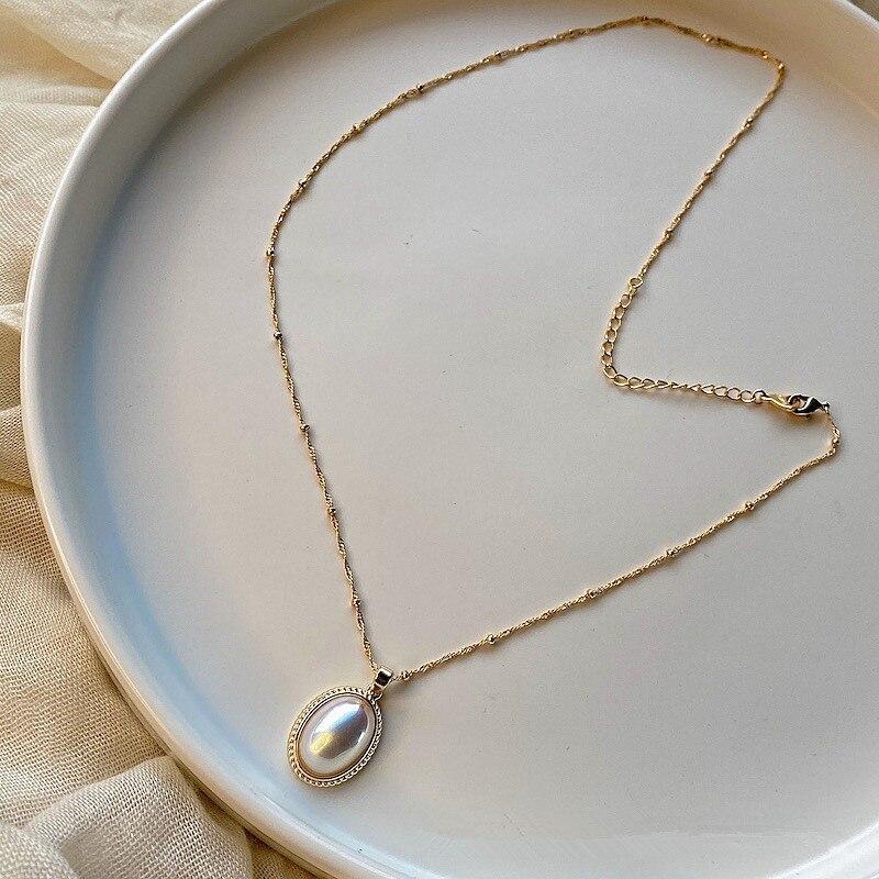 SCHITTERENDE VINTAGE PUUR GOUD & PAREL KETTING