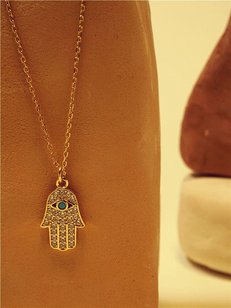 OVERVLOEDIGE VOORSPOED TURQUOISE & GOUDEN HAMSA HANDKETTING