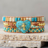 GOUDEN KRUIS TURQUOISE WIKKELARMBAND